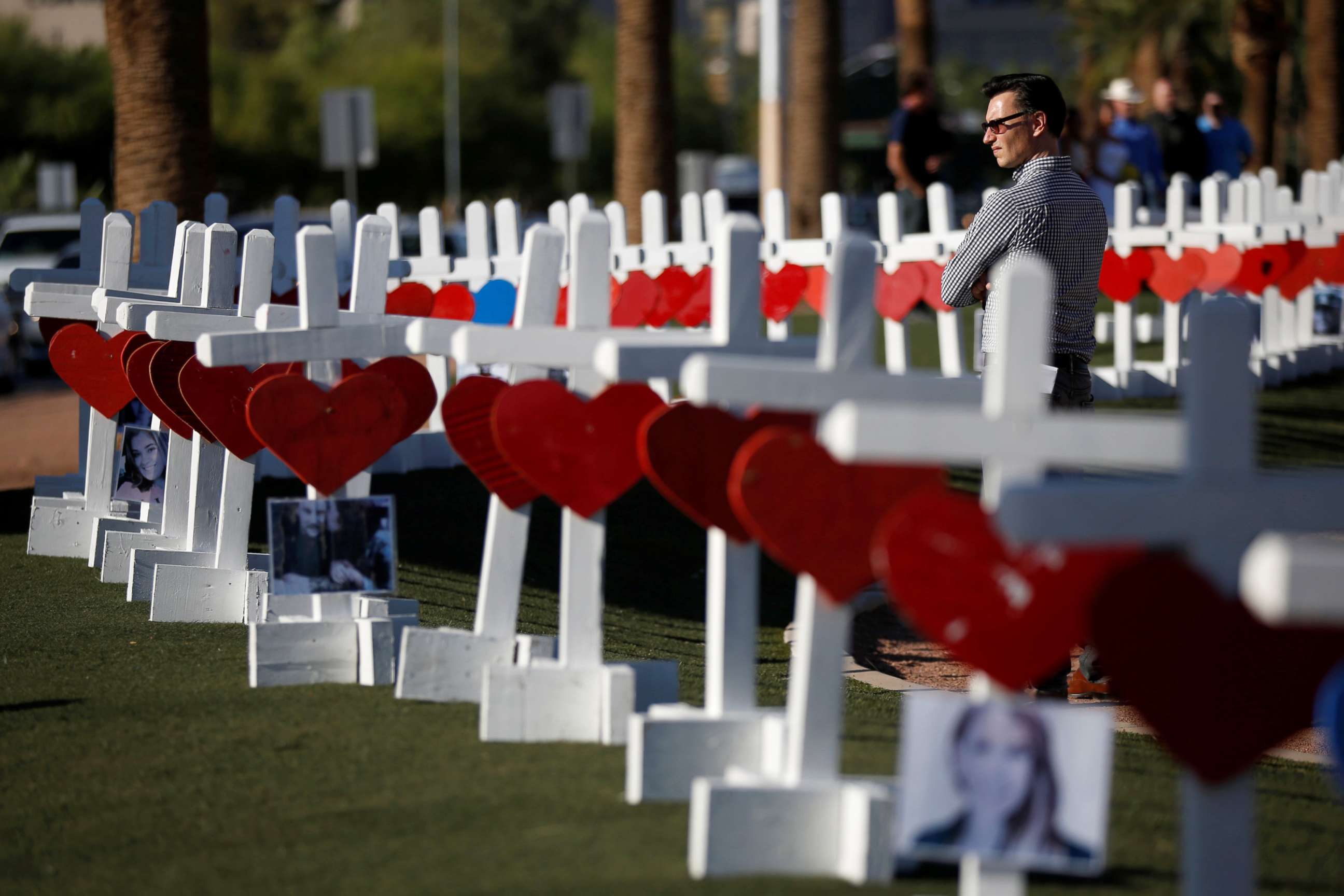 PHOTO: A man looks at the 58 white crosses set up for the victims of the Route 91 music festival mass shooting in Las Vegas, Oct. 5, 2017.