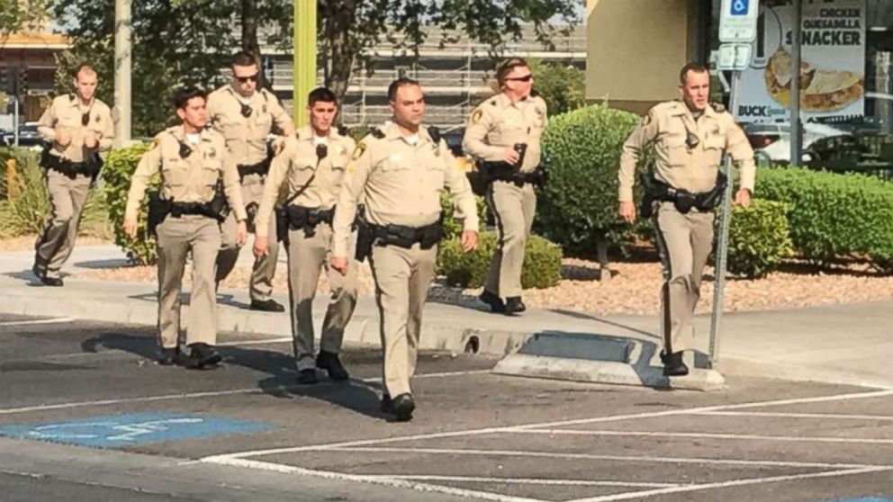 Police officers respond to a shooting at a Ross Dress for Less store in Las Vegas on Saturday, Aug. 11, 2018.