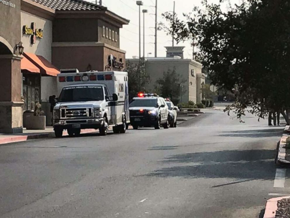 Police officers respond to a shooting at a Ross Dress for Less store in Las Vegas on Saturday, Aug. 11, 2018.