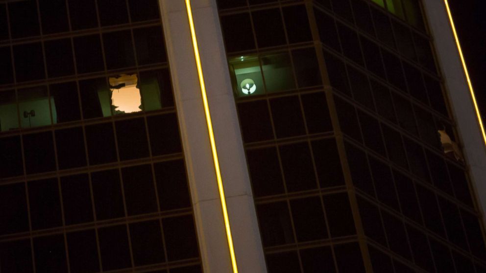 Broken windows are visible in a 32nd-floor suite at the Mandalay Bay Resort and Casino from which a gunman opened fire in Las Vegas, Oct. 2 , 2017.