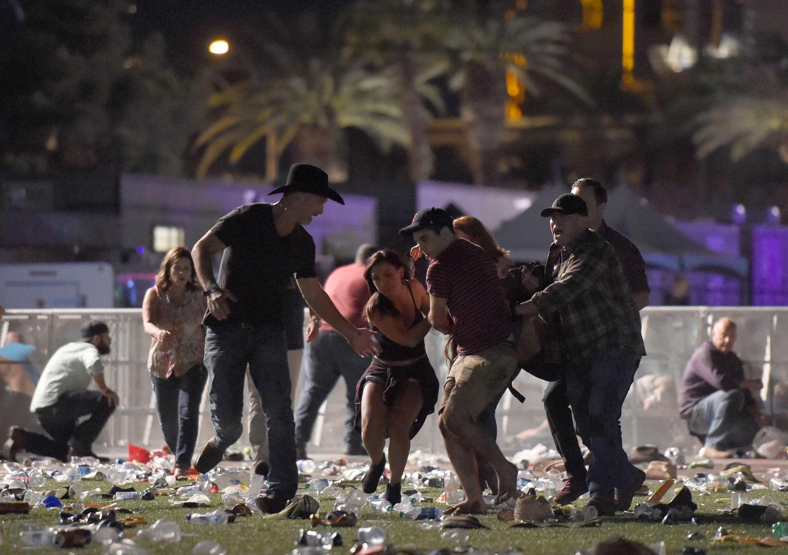 PHOTO: People carry a an injured person at the Route 91 Harvest country music festival after gun fire was heard, Oct. 1, 2017 in Las Vegas.
