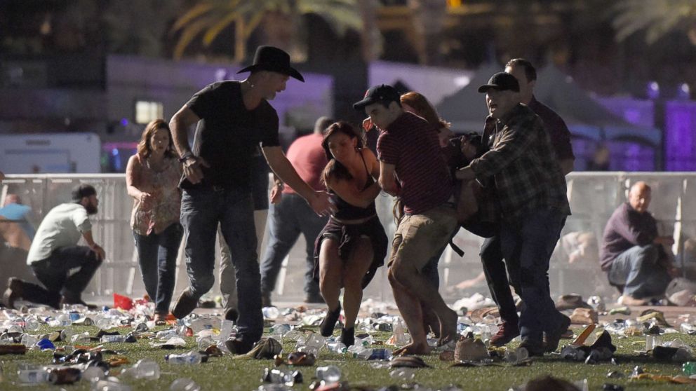 PHOTO: People carry a an injured person at the Route 91 Harvest country music festival after gun fire was heard, Oct. 1, 2017 in Las Vegas.