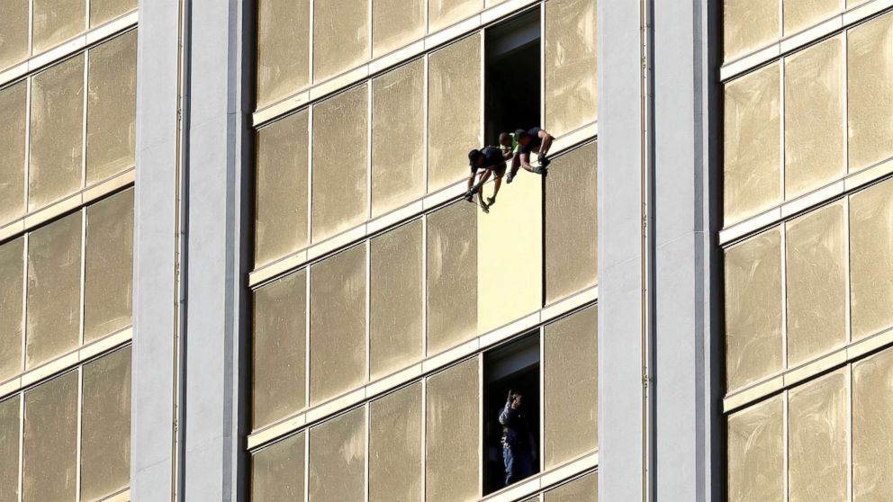 Workers board up a broken window at the Mandalay Bay hotel, where shooter Stephen Paddock conducted his mass shooting along the Las Vegas Strip, in Las Vegas, Nevada, Oct. 6, 2017. 