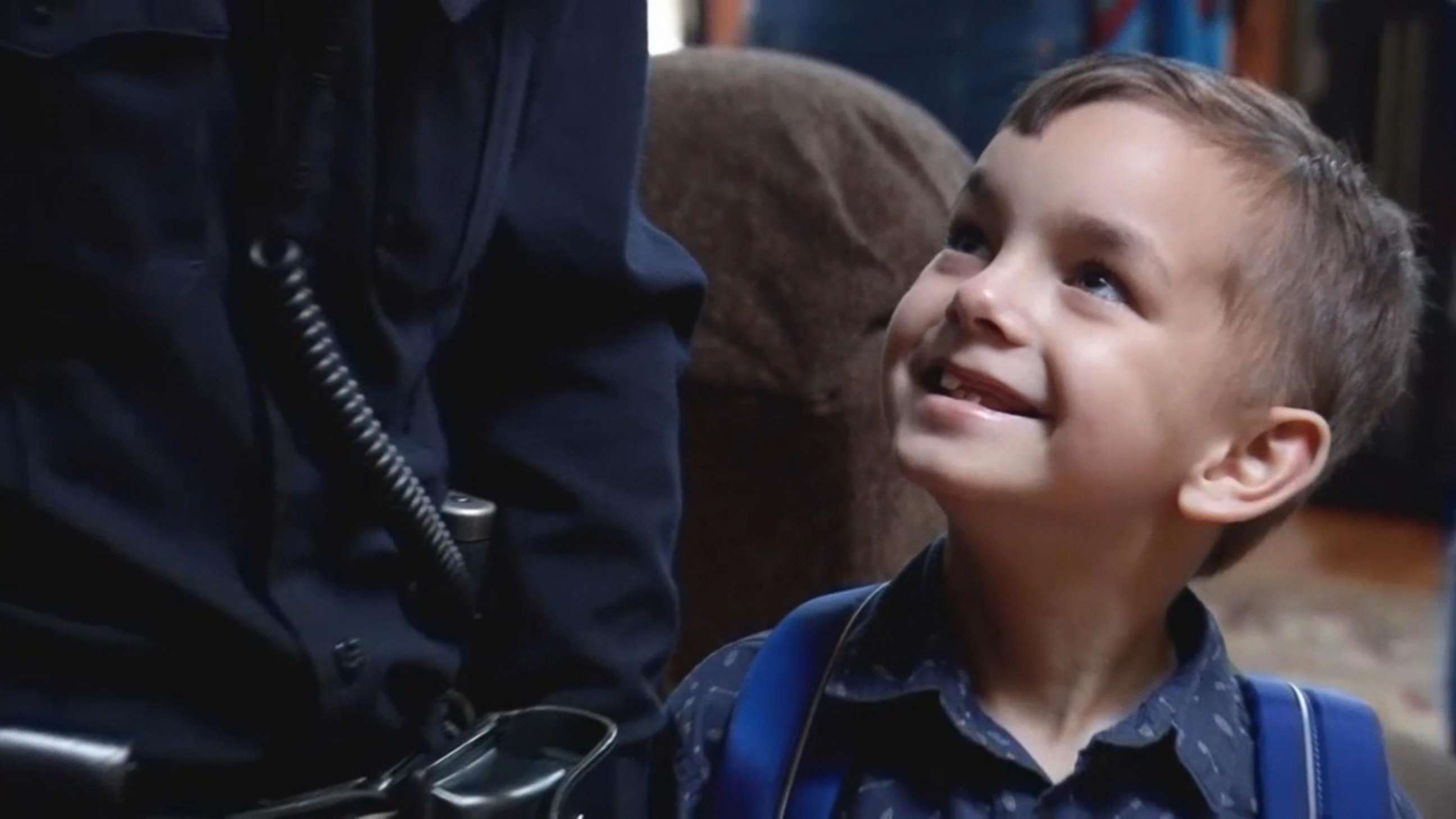 PHOTO: Seven-year-old Liam Silveira of Maine smiles at Officer Dan Gastia of the Bangor Police Department on the day of his last cancer treatment.