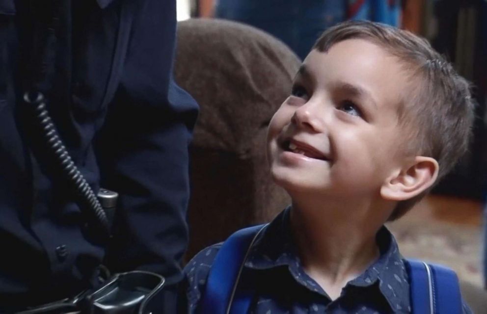 PHOTO: Seven-year-old Liam Silveira of Maine smiles at Officer Dan Gastia of the Bangor Police Department on the day of his last cancer treatment.