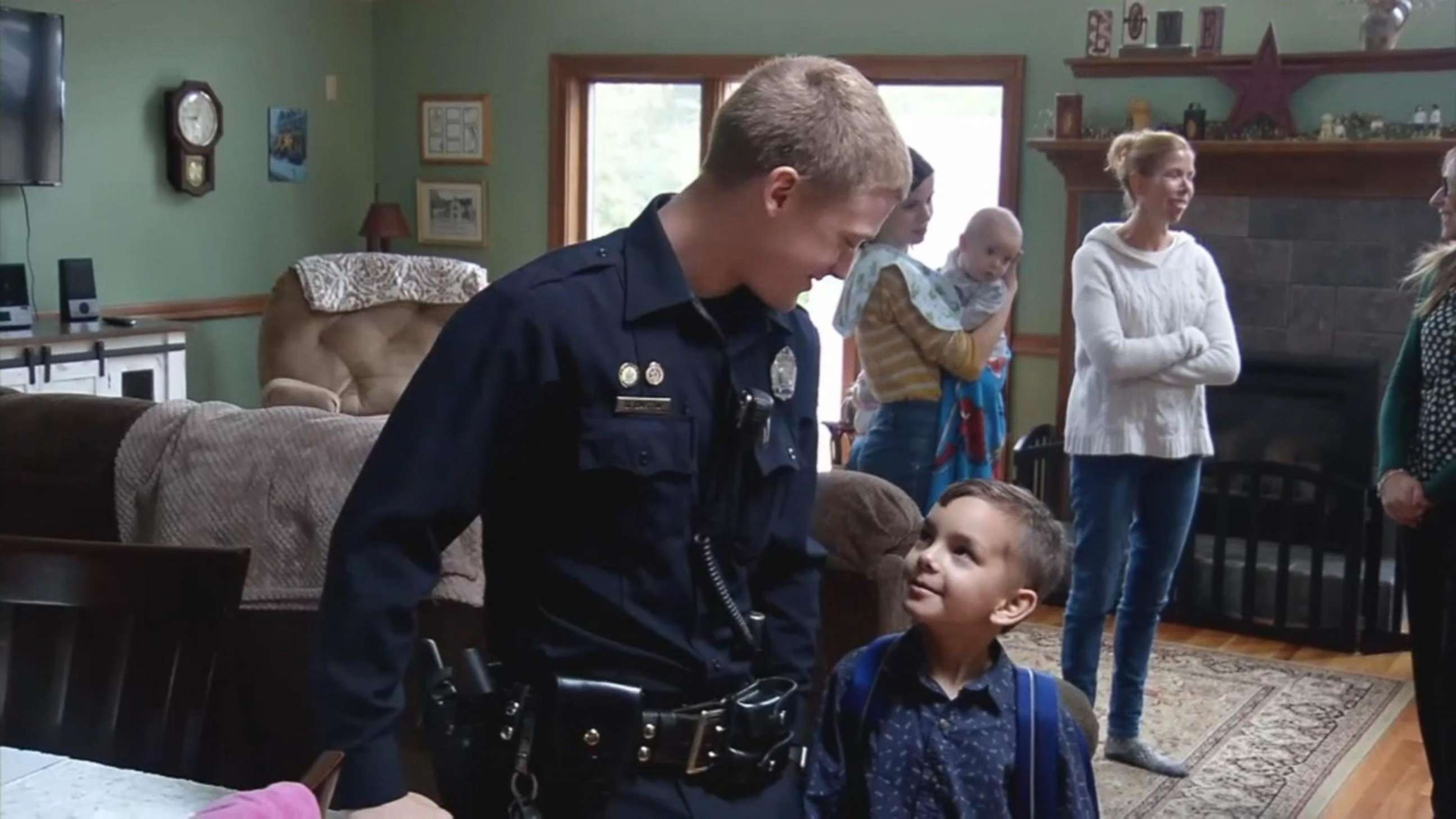 PHOTO: Seven-year-old Liam Silveira of Maine smiles at Officer Dan Gastia of the Bangor Police Department on the day of his last cancer treatment.