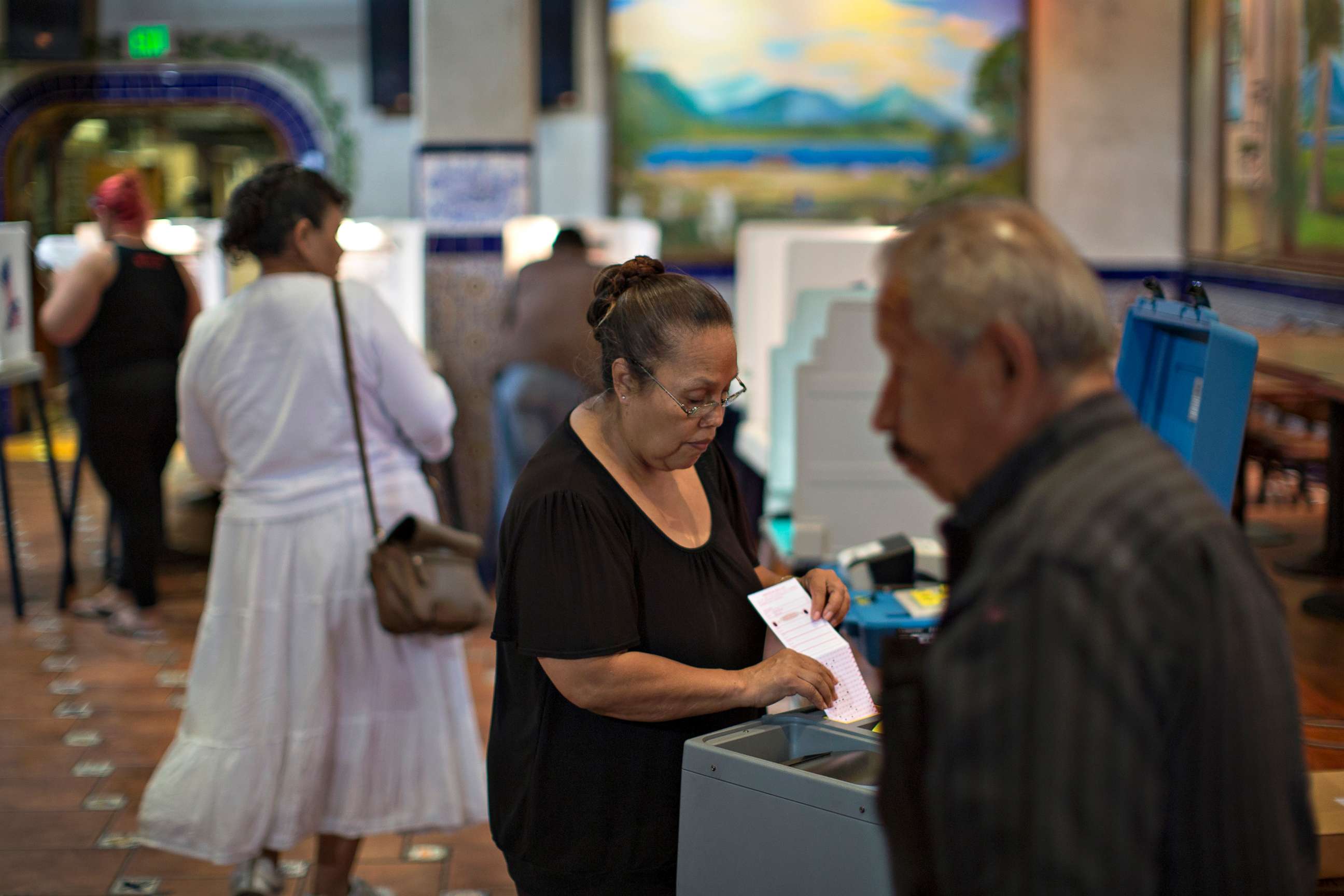 PHOTO: Latinos vote at a polling station in El Gallo Restaurant on Nov. 8, 2016 in the Boyle Heights section of Los Angeles.