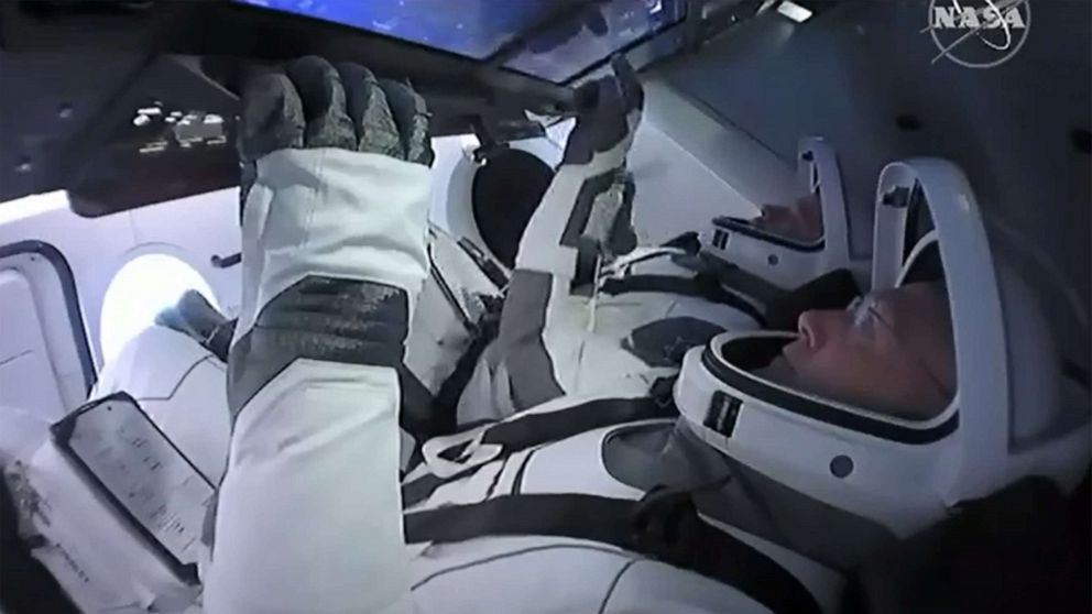 PHOTO: This still image taken from NASA TV, shows the SpaceX Crew Dragon capsule, with astronauts Bob Behnken (front) and Doug Hurley, at Launch Coomplex 39A in Kennedy Space Center in Florida on May 27, 2020.