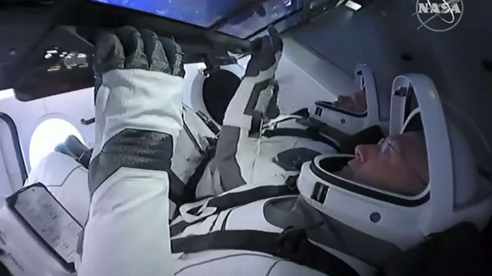 PHOTO: This still image taken from NASA TV, shows the SpaceX Crew Dragon capsule, with astronauts Bob Behnken (front) and Doug Hurley, at Launch Coomplex 39A in Kennedy Space Center in Florida on May 27, 2020.