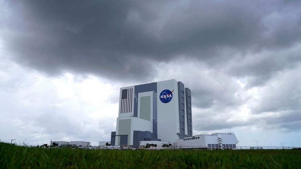 PHOTO: Storm clouds pass over the Vehicle Assembly Building as a SpaceX Falcon 9, with NASA astronauts Doug Hurley and Bob Behnken in the Crew Dragon capsule, sits on Launch Pad 39-A at the Kennedy Space Center in Cape Canaveral, Fla., May 30, 2020.