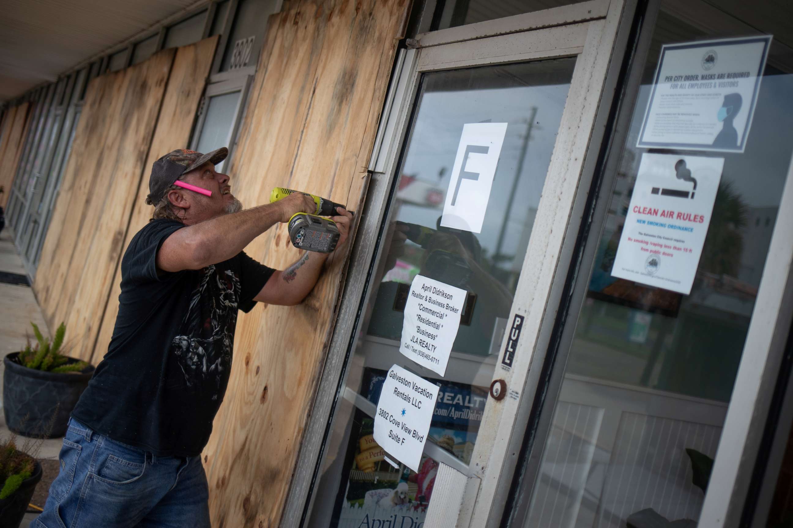 PHOTO: Local resident Robert Sawyer, 48, boards up businesses ahead of Hurricane Laura in Galveston, Texas, Aug. 26, 2020.