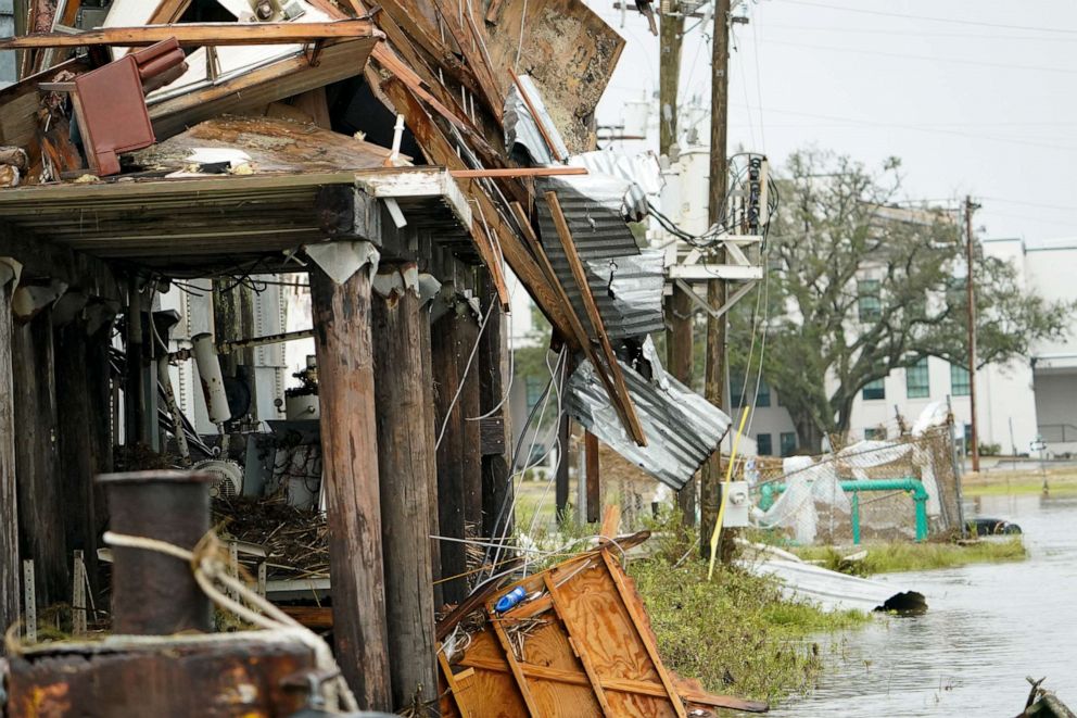 PHOTO: Flooding surrounds a damaged building Friday, Aug. 28, 2020, in Cameron, La., after Hurricane Laura moved through the area Thursday.