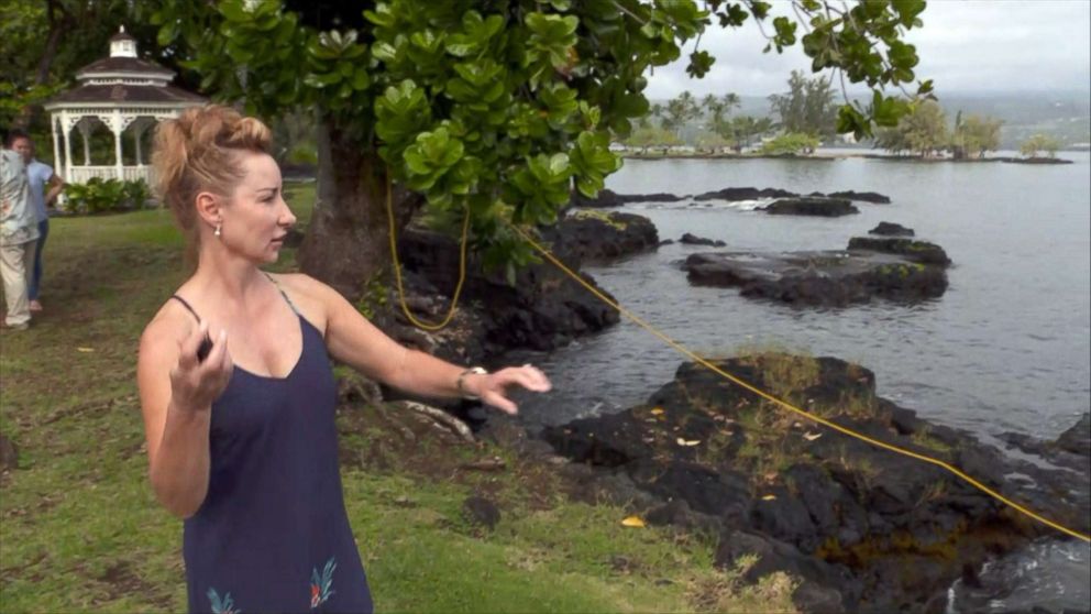 PHOTO: Dawn Li throws a lava rock back into the ocean after it hit her while riding on a tour boat on July 16, 2018 in Hawaii.