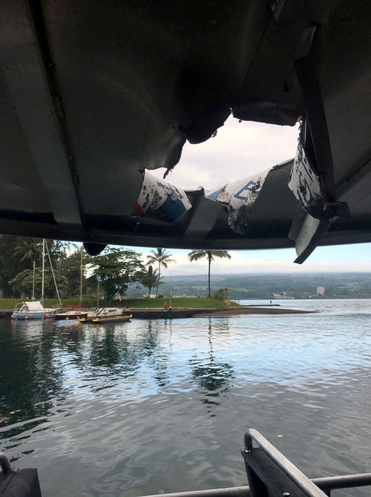 PHOTO: A hole, punched through the roof of a tourist boat, is seen, after lava from the Mount Kilauea volcano exploded in the sea off Kapoho, Hawaii, July 16, 2018.