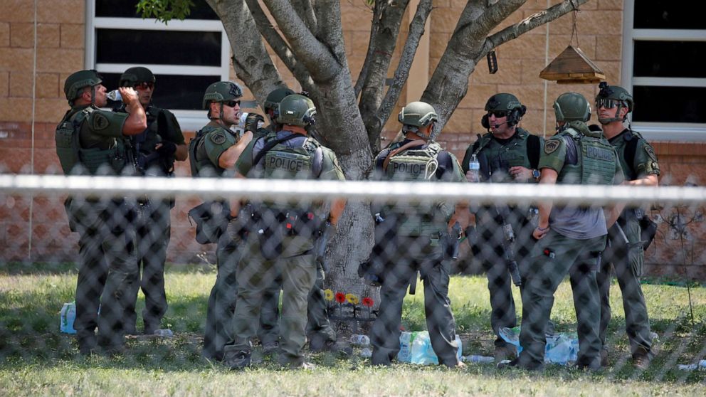 PHOTO: Law enforcement personnel stand outside Robb Elementary School following a shooting, May 24, 2022, in Uvalde, Texas. 