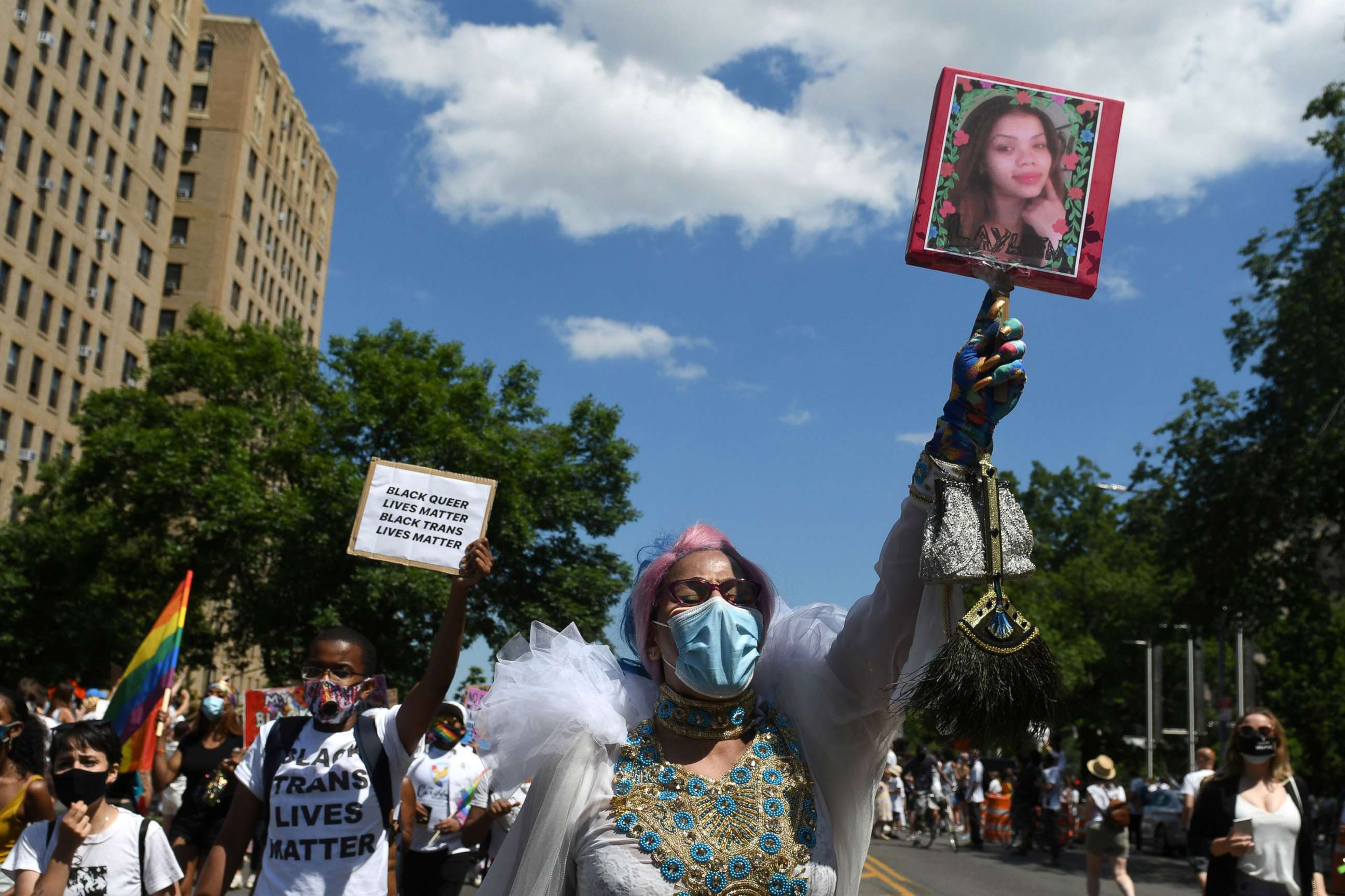 PHOTO: A person holds up a picture of Layleen Polanco, a transgender person who died at the Rikers Island prison, during a Black Trans Lives Matter rally in Brooklyn, NY., June 14, 2020.