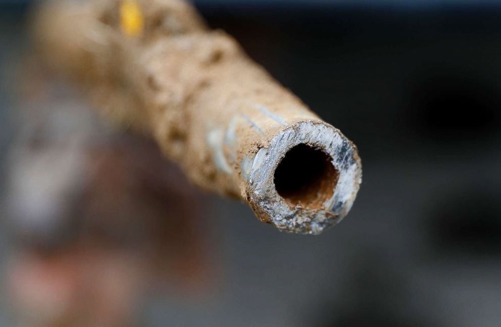 PHOTO: A lead pipe is shown after being replaced by a copper water supply line to a home in Flint, Mich., July 20, 2018.