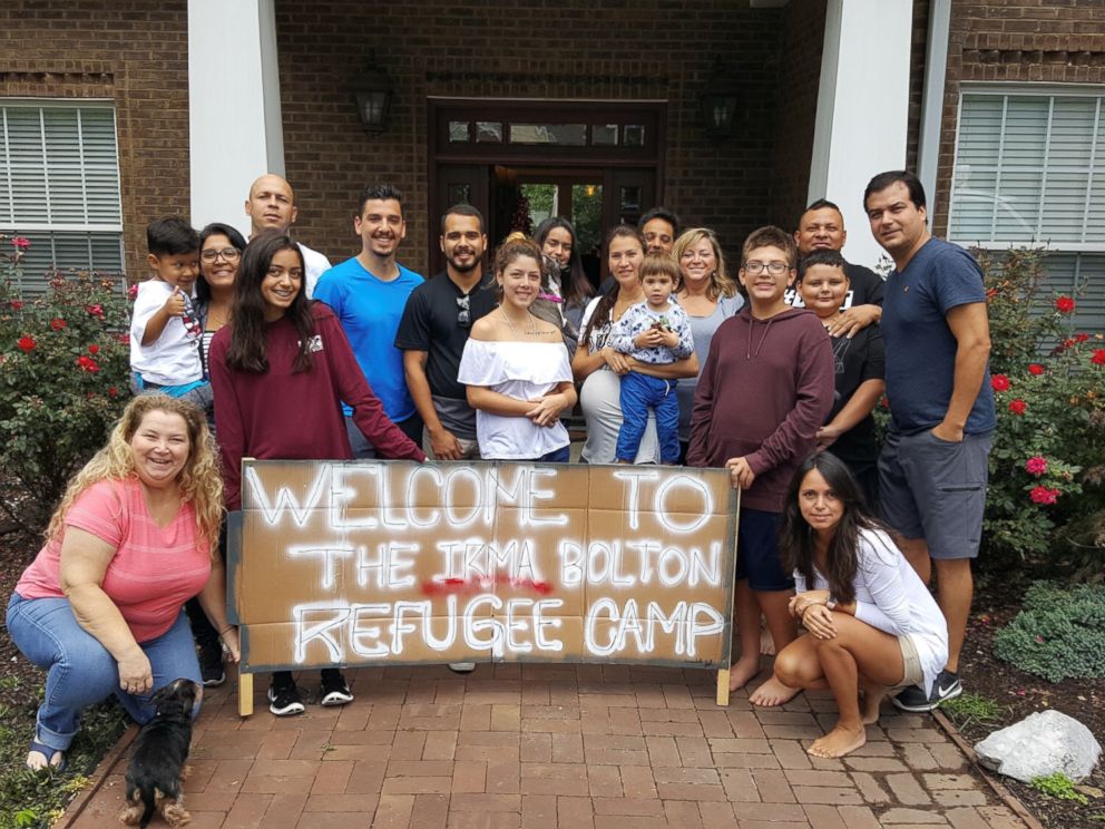 PHOTO: Leah Bolton (standing, fifth from right) opened her home in Tennessee to 26 people evacuating from 2017s Hurricane Irma.