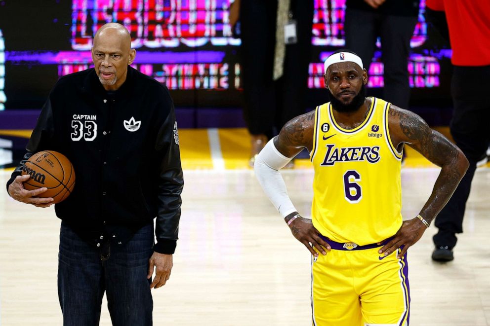 PHOTO: Kareem Abdul-Jabbar stands on court with LeBron James of the Los Angeles Lakers after James passed Abdul-Jabbar to become the NBA's all-time leading scorer in a games against the Oklahoma City Thunder, Feb. 7, 2023, in Los Angeles.