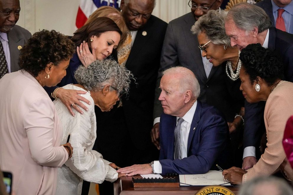 PHOTO: Ninety-four-year-old activist and retired educator Opal Lee, known as the Grandmother of Juneteenth, speaks with President Biden after he signed the Juneteenth National Independence Day Act into law at the White House, June 17, 2021, in Washington.