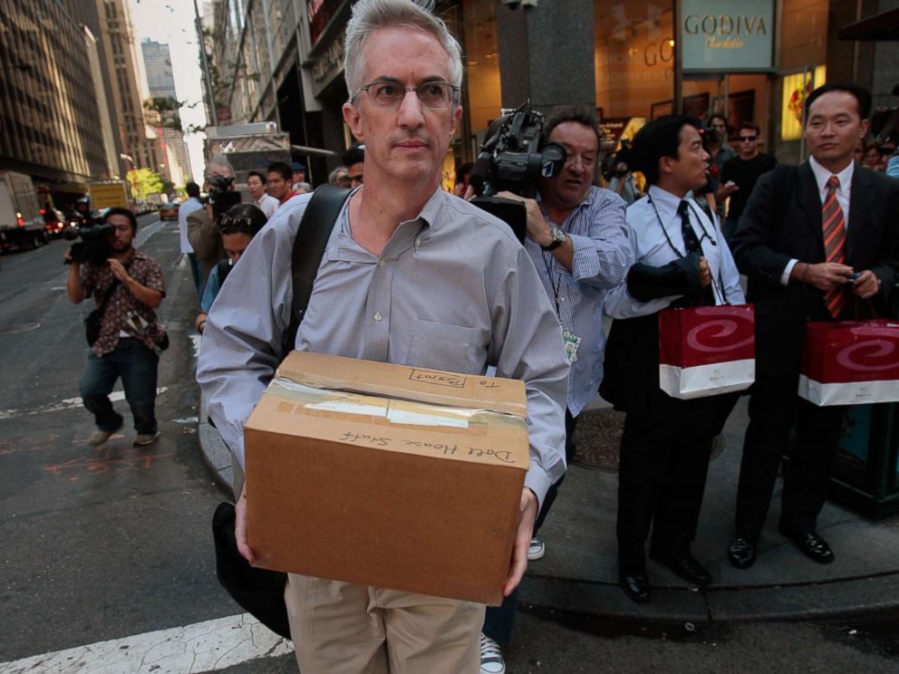 PHOTO: An employee of Lehman Brothers Holdings Inc. carries a box out of the companys headquarters building (background) Sept. 15, 2008 in New York.