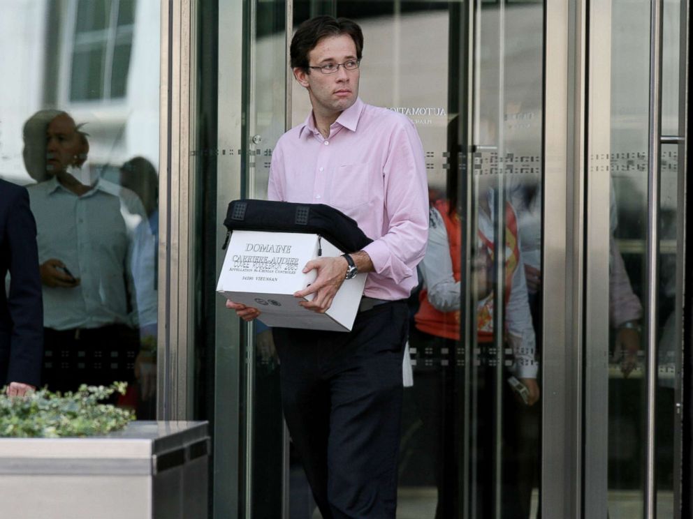 On September 15, 2008, a man carrying a box leaves Lehman Brothers' European headquarters in Canary Wharf, East London. 