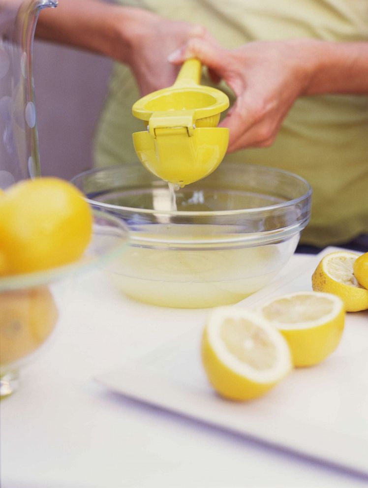 PHOTO: A woman juices a lemon in this undated stock image.