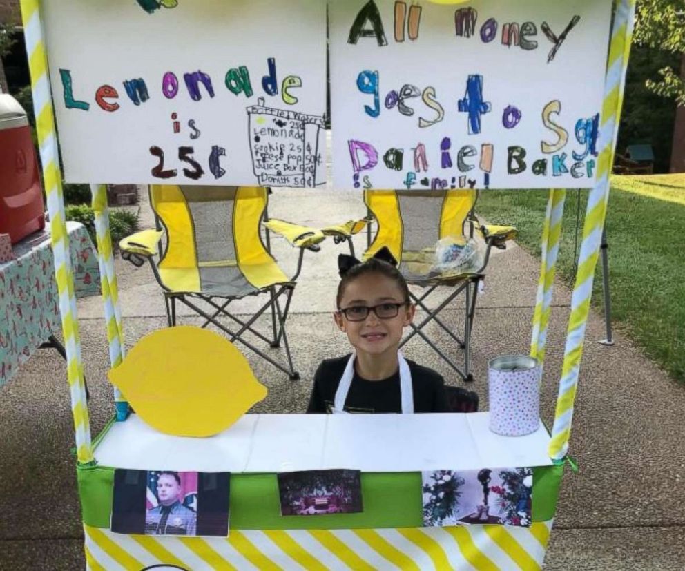 PHOTO: Caroline Freeman set up a lemonade stand Saturday to raise money for the wife and young daughter of Sgt. Daniel Baker, who was killed in the line of duty on May 30.