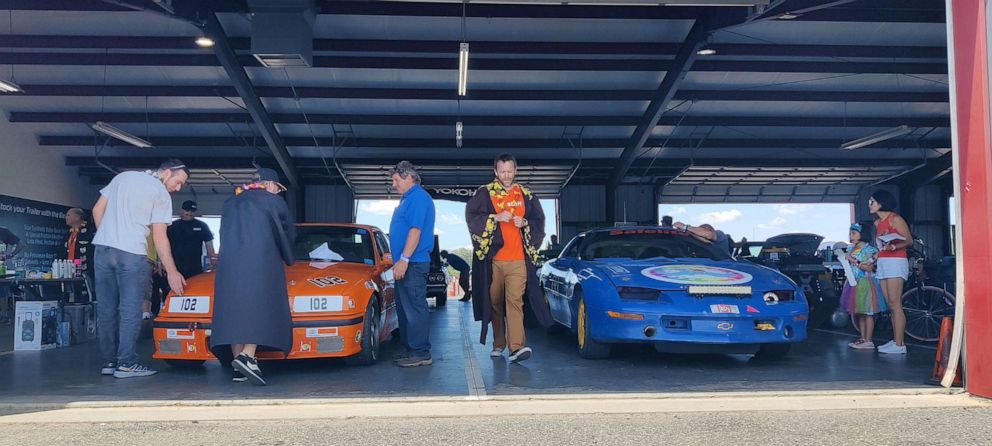 PHOTO: Eric Rood and other race organizers decide whether participants’ cars are worth $500 or less.