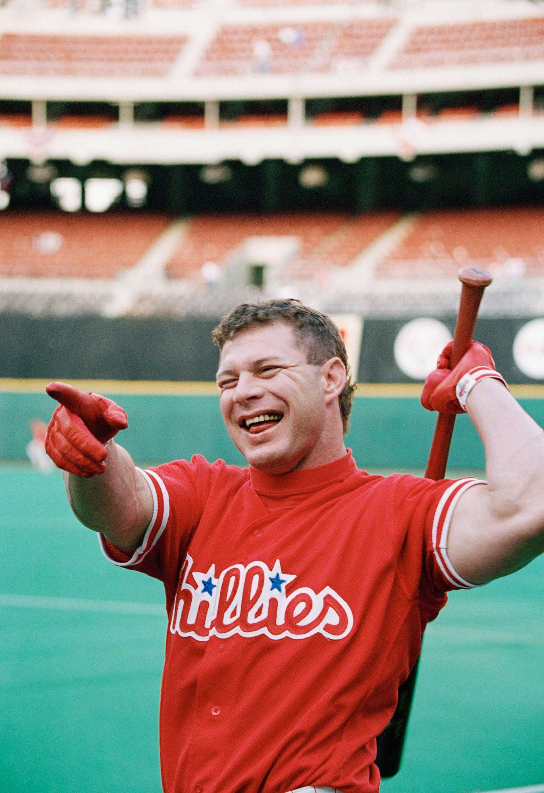 PHOTO: Philadelphia Phillies outfielder Lenny Dykstra laughss before the start of Game 2 of the National League playoffs at Philadelphia's Veterans Stadium, Oct. 7, 1993.