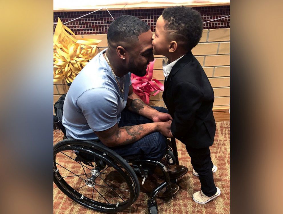 PHOTO: Leon Ford, an activist, author and father left paralyzed from the waist down after being shot by Pittsburgh police officers in 2012, poses alongside his son.