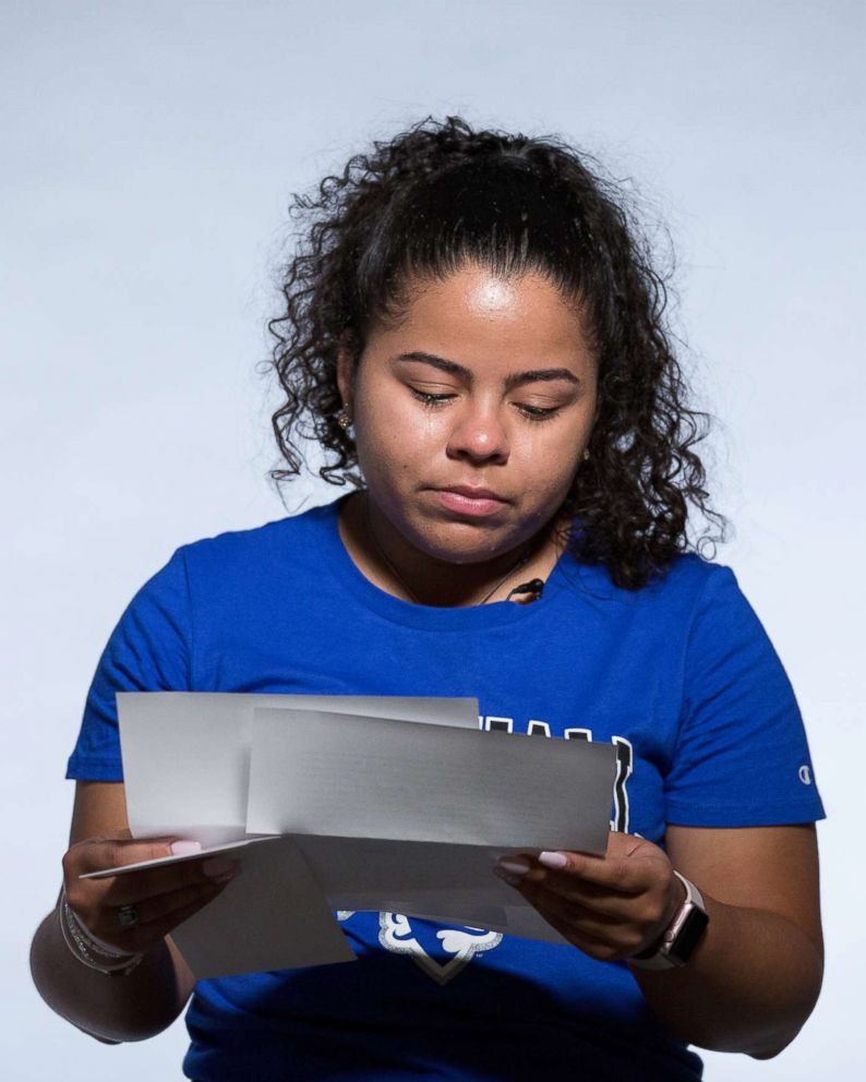 PHOTO: First generation college students read letters from their parents. Pictured: Elizabeth Rodriguez