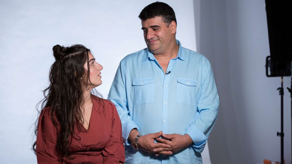 PHOTO: First generation college students read letters from their parents. Pictured: Yeliz Sezgin and her father