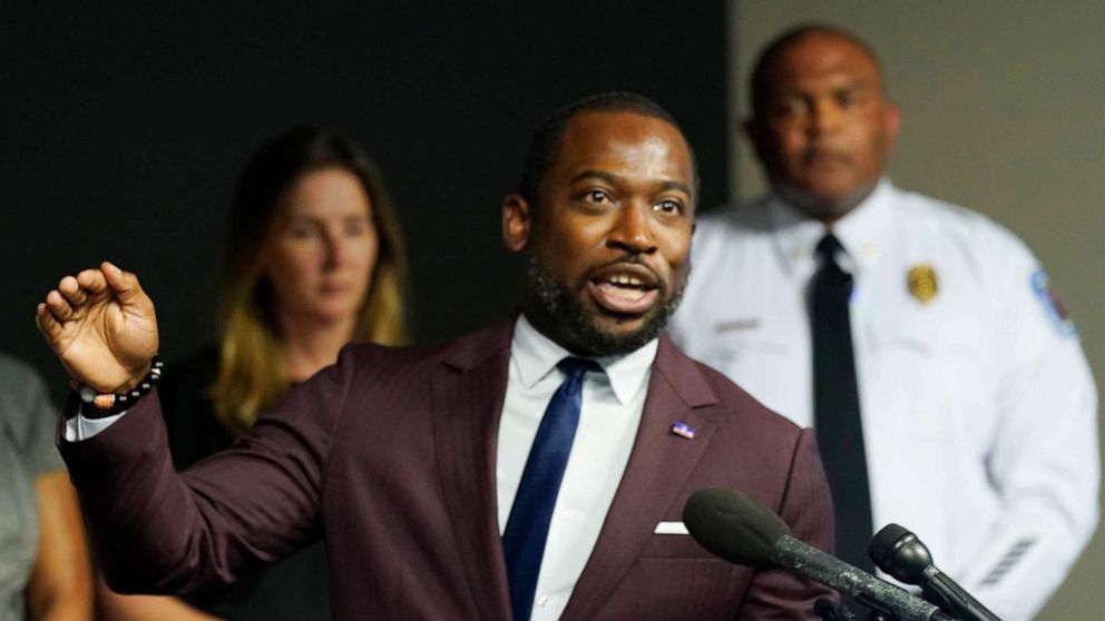 PHOTO: Richmond Mayor Levar Stoney, left, gestures while Police Chief Gerald M Smith, right, listens during a press conference at Richmond Virginia Police headquarters, July 6, 2022, in Richmond, Va.