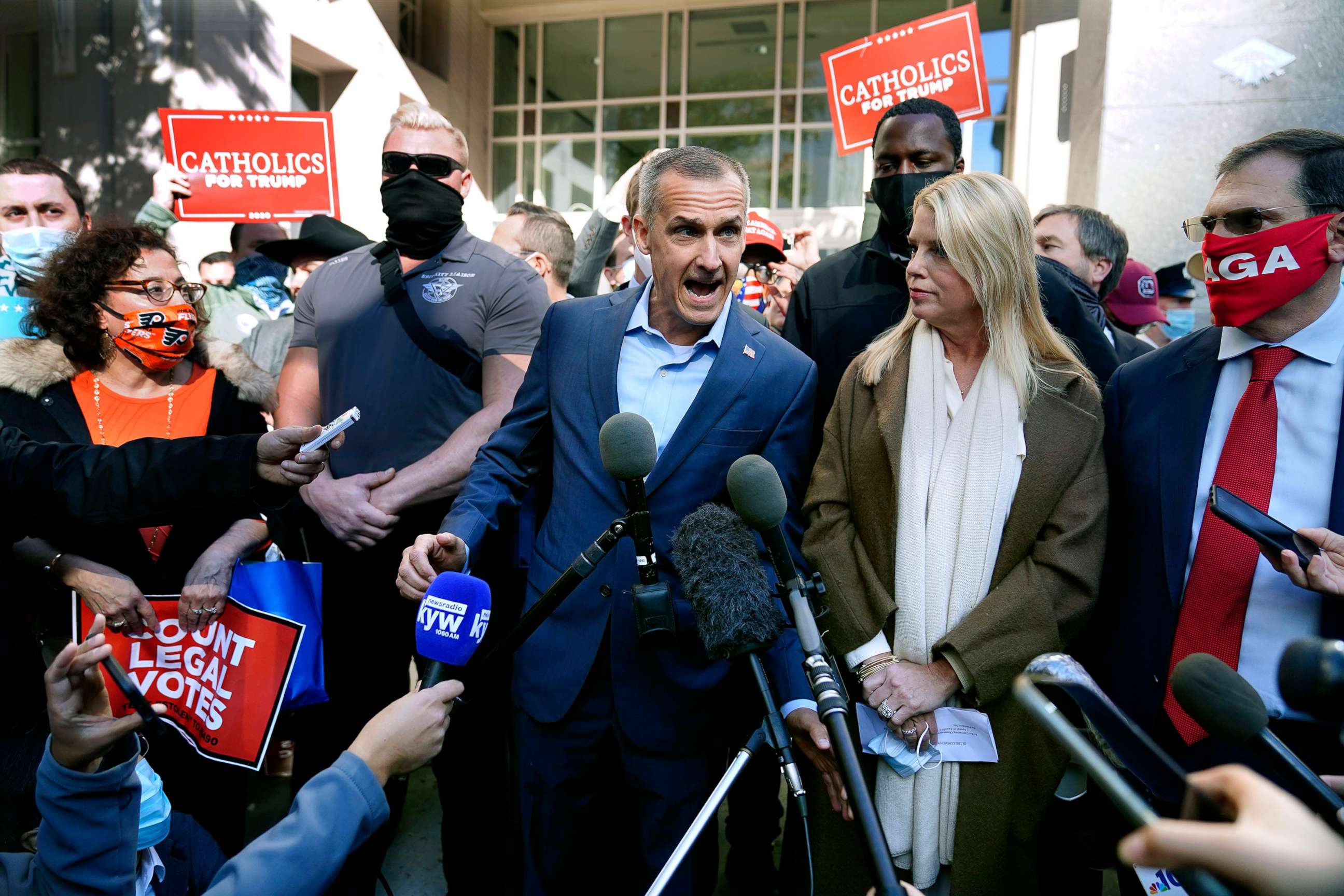 PHOTO: President Donald Trump's campaign advisor Corey Lewandowski, center, speaks about a court order obtained to grant more access to vote counting operations at the Pennsylvania Convention Center, Nov. 5, 2020, in Philadelphia.