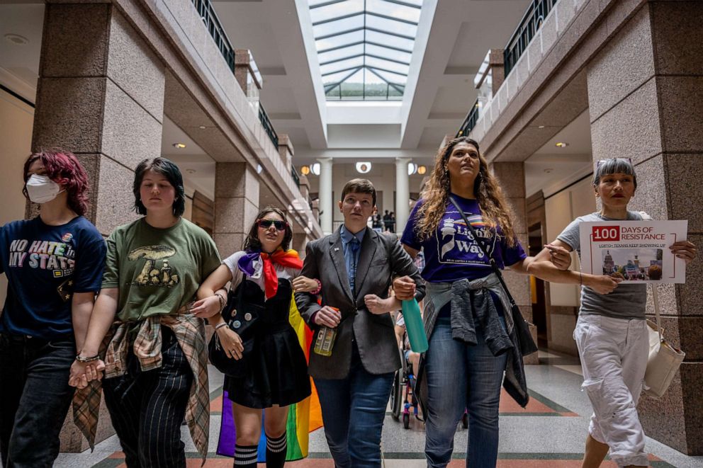 PHOTO: People march through the Texas State Capitol on April 20, 2023 in Austin, Texas.