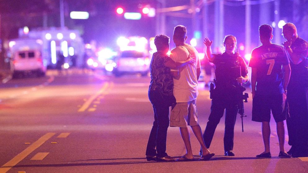 PHOTO: Police officers direct family members away from a fatal shooting at Pulse Orlando nightclub in Orlando, Fla., June 12, 2016.