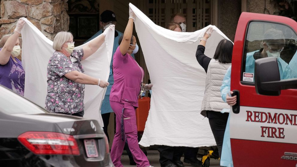 PHOTO: Health workers transfer a patient on a stretcher to an ambulance at the Life Care Center of Kirkland, the long-term care facility linked to several confirmed coronavirus cases in the U.S. state, in Kirkland, Washington, March 1, 2020.