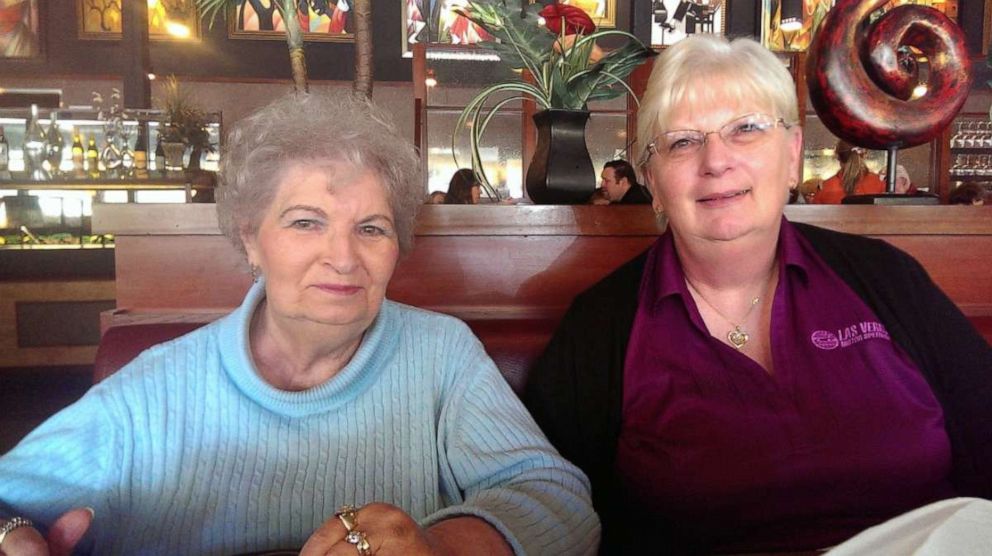 PHOTO: Debbie de los Angeles poses for a photo with her mother Twilla Morin in a restaurant in Washington, on May 4, 2014 in this handout photo obtained by Reuters on March 21, 2020.  