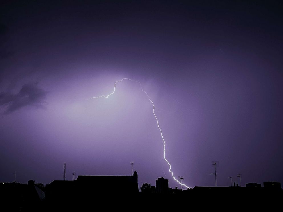 PHOTO: Lightning is seen during a storm over the roofs in Tours, France, Aug. 29, 2018.