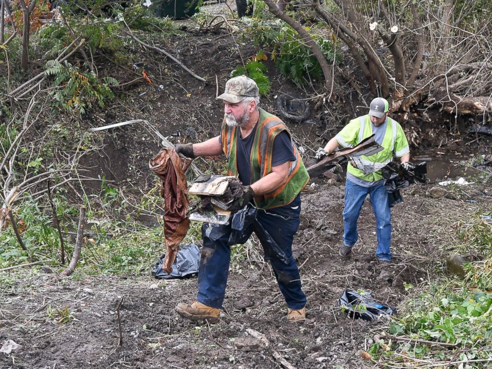 PHOTO: Recovery crews remove debris from the scene of a fatal crash, Sunday, Oct. 7, 2018, where a limousine crashed into a parked and unoccupied SUV killing 20 people at an intersection a day earlier, in Schoharie, N.Y. 