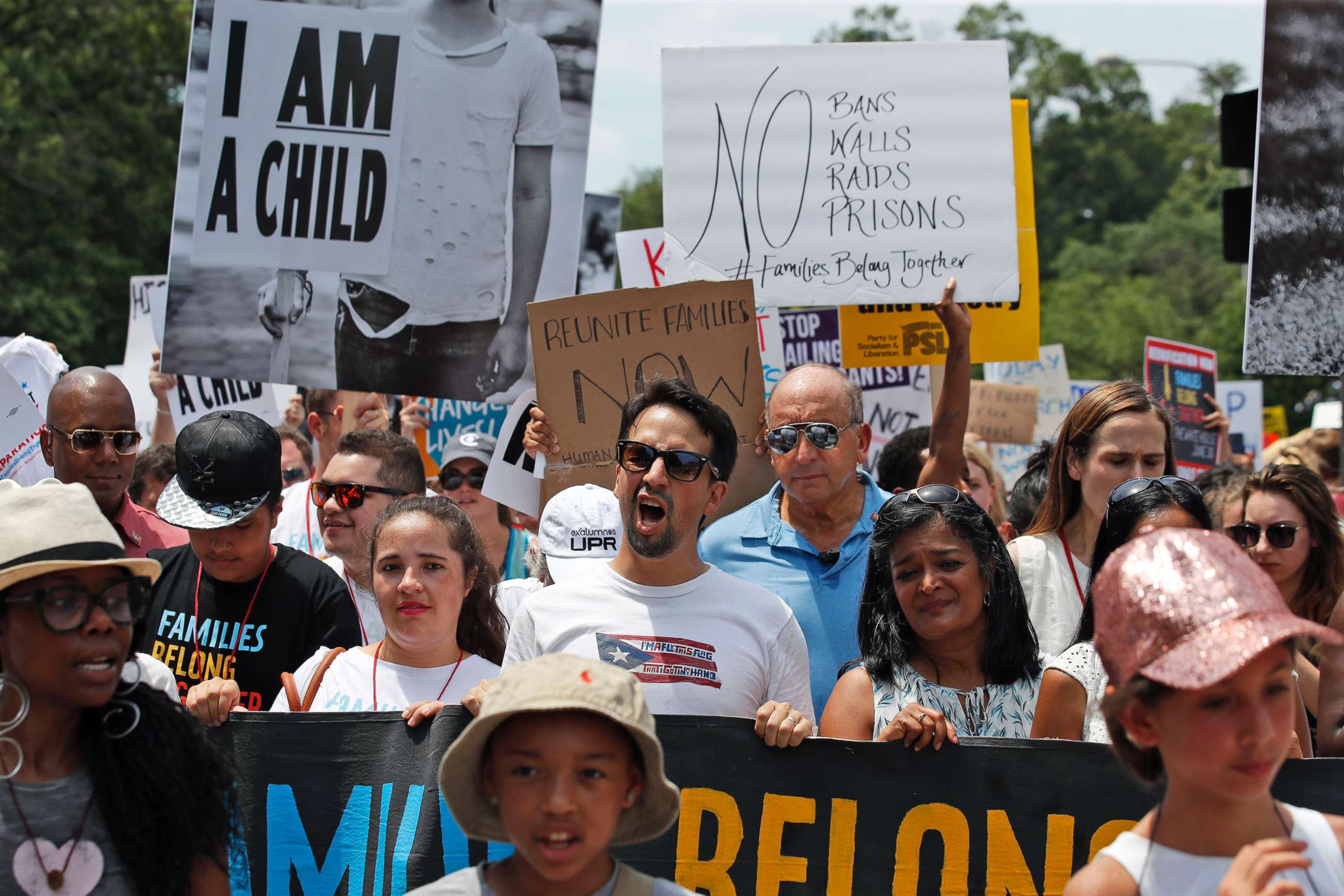 PHOTO: Activists, including Lin-Manuel Miranda, center, yell as they march to protest the Trump administration's approach to illegal border crossings and separation of children from immigrant parents, June 30, 2018, in Washington.