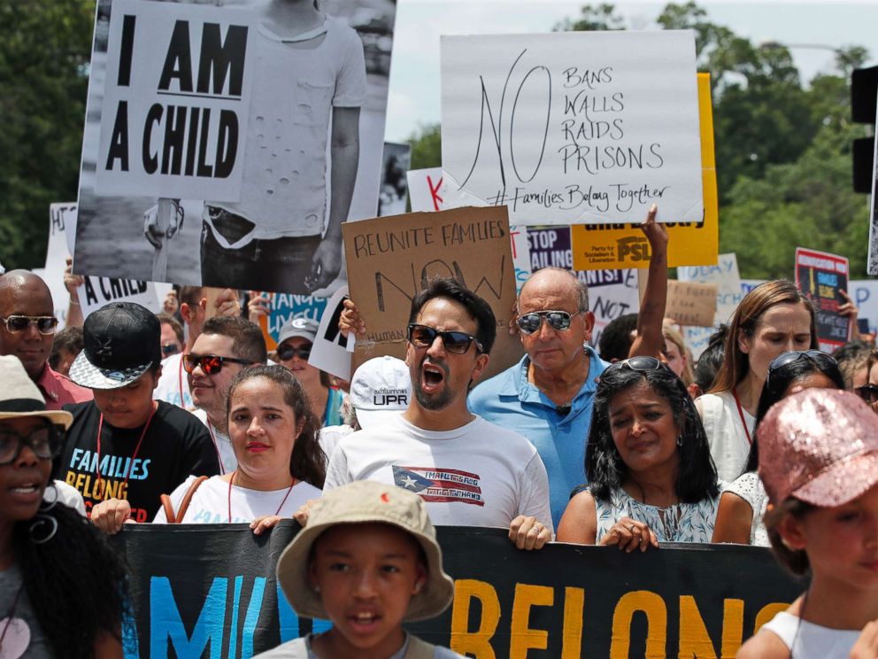 PHOTO: Activists, including Lin-Manuel Miranda, center, yell as they march to protest the Trump administrations approach to illegal border crossings and separation of children from immigrant parents, June 30, 2018, in Washington.