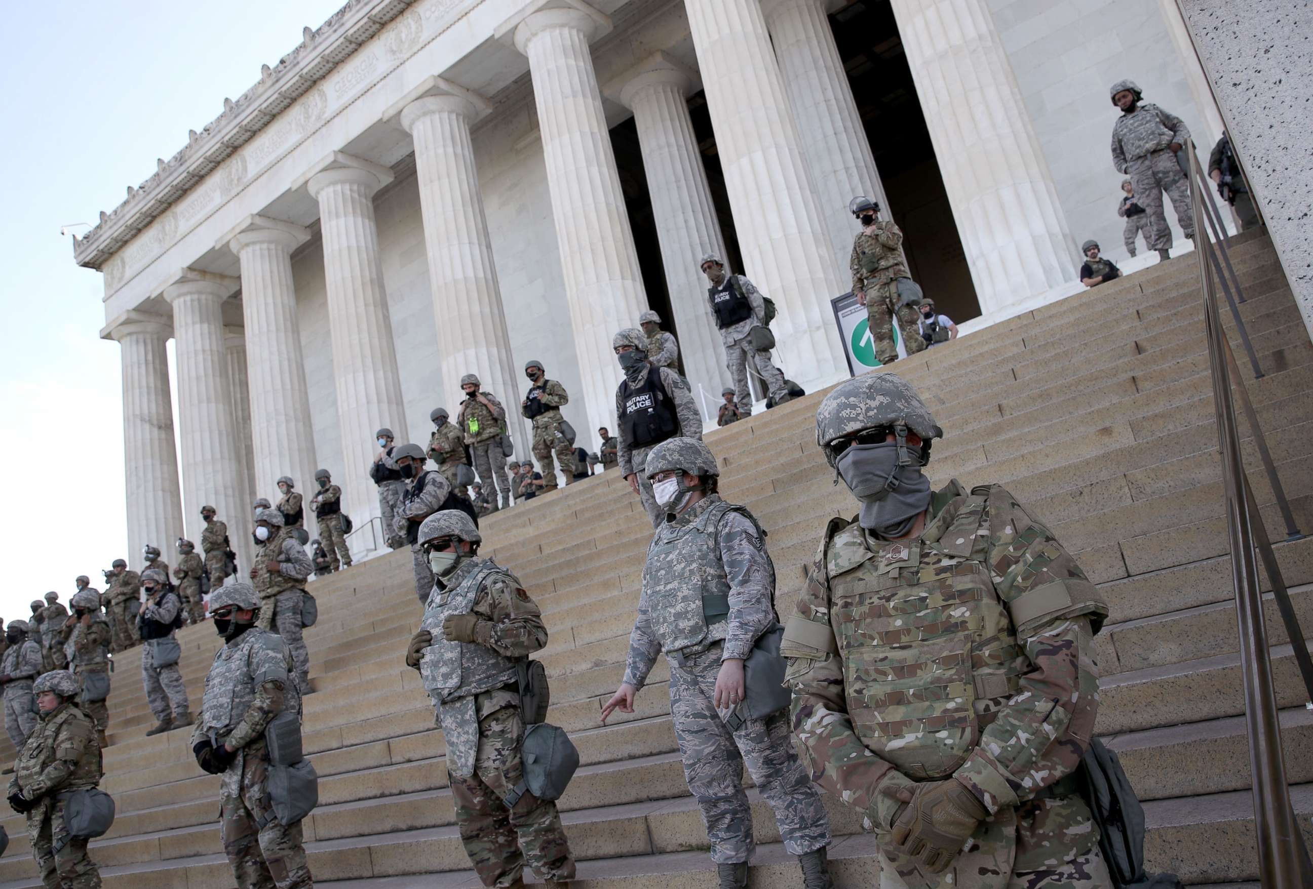 PHOTO: In this June 2, 2020, file photo, members of the D.C. National Guard stand on the steps of the Lincoln Memorial in Washington, D.C., as demonstrators participate in a peaceful protest against police brutality and the death of George Floyd.