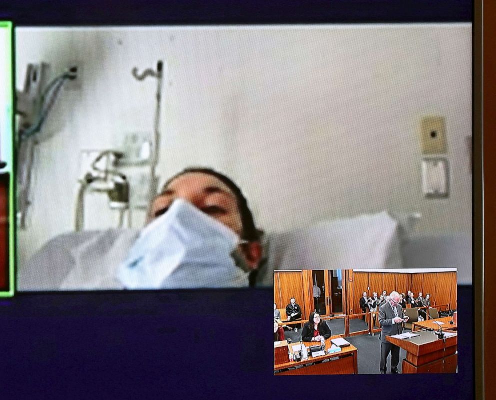 PHOTO: In this video screen image, Lindsay Clancy with a surgical mask over her face in a hospital appears during her arraignment in the deaths of her three children at Plymouth District Court, February 7, 2023, in Plymouth , Mass.