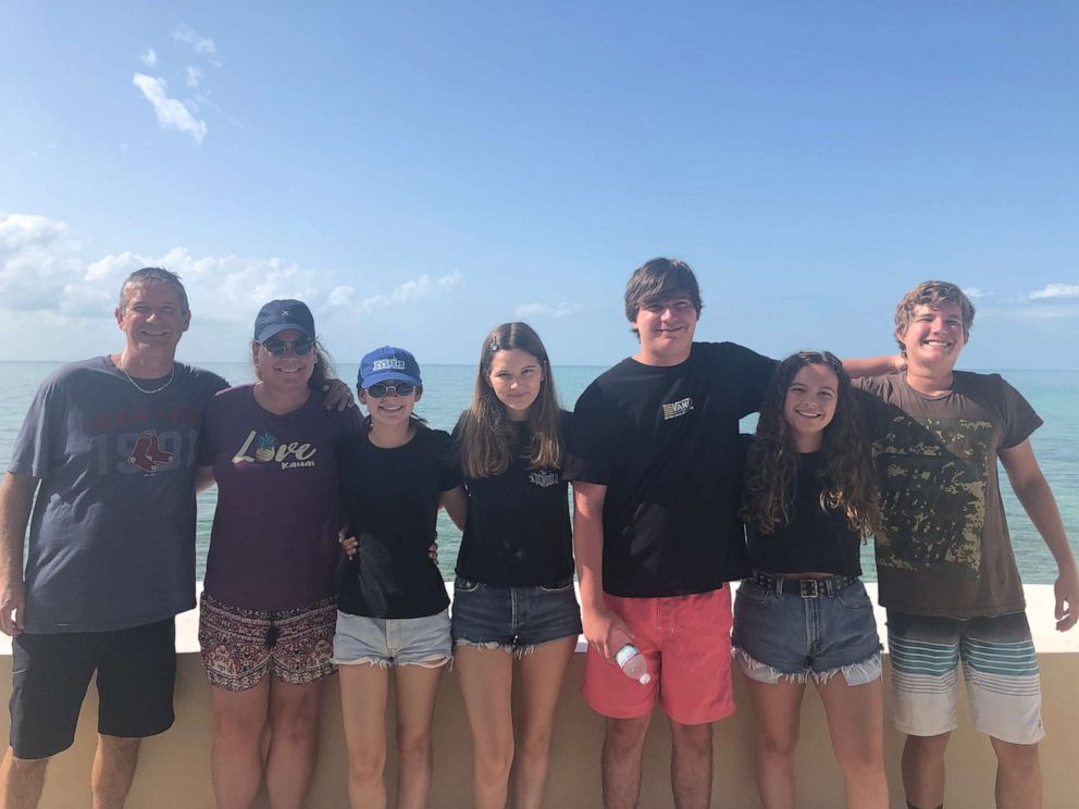 PHOTO: Jordan Lindsey, center, poses with her parents, two brothers, sister and girlfriend on their trip to the Bahamas. Lindsey, 21, was killed in a shark attack near Rose Island on Wednesday, June 26, 2019.