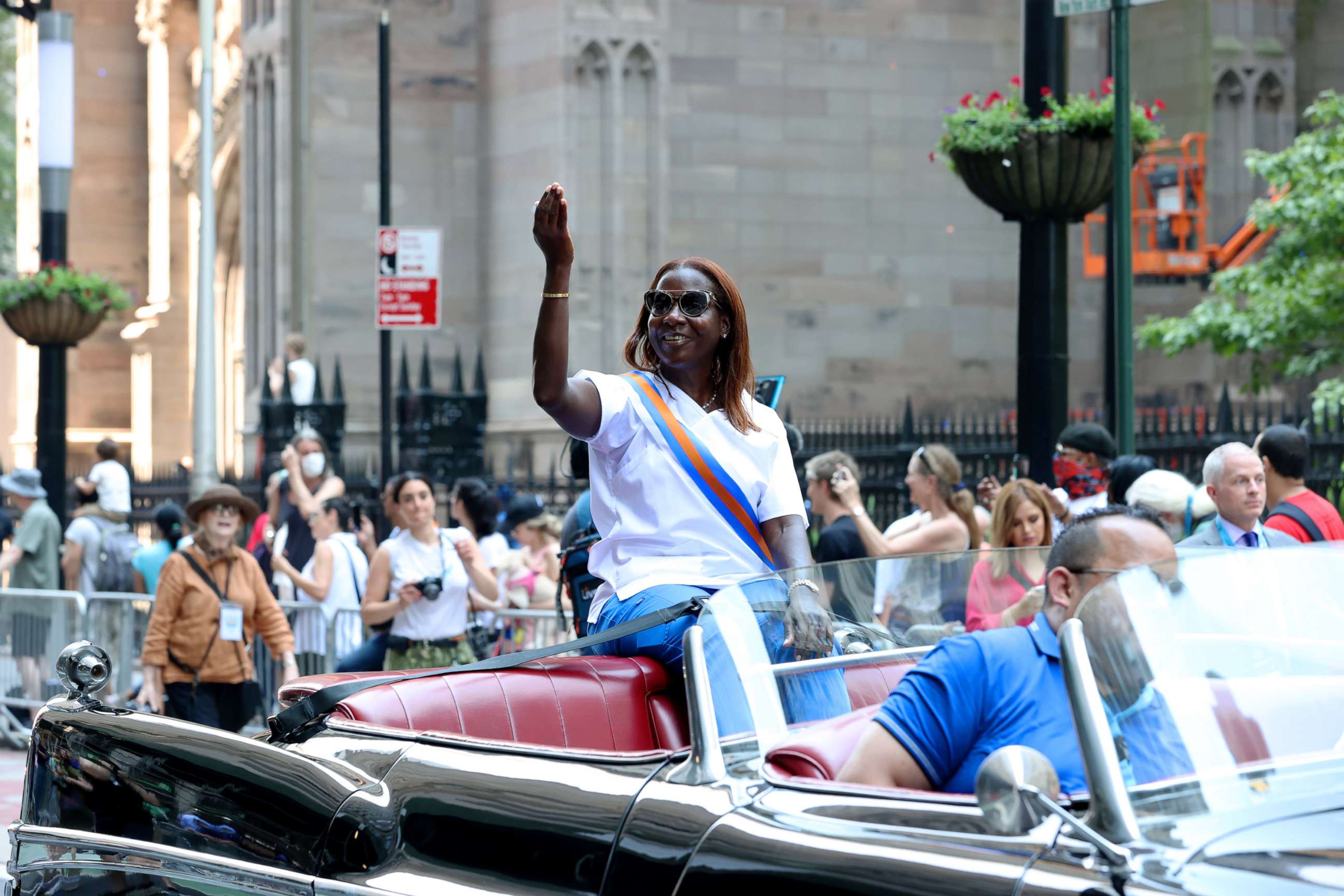 PHOTO: Nurse Sandra Lindsay from Northwell Health's Long Island Jewish Medical Center in New Hyde Park, waves to the crowd while riding in the "Hometown Heroes" ticker tape parade, July 7, 2021, in New York City.