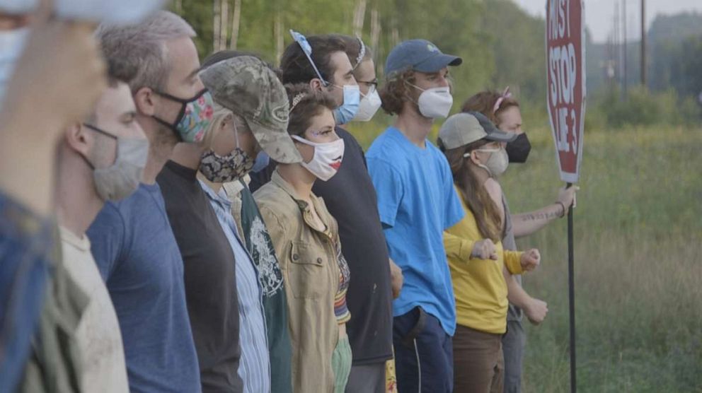 PHOTO: Members of a pipeline opposition camp participate in a "direct action" against the Line 3 pipeline.