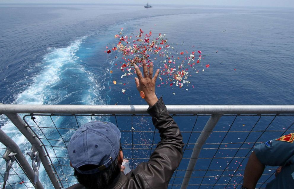 PHOTO: A man scatters flower petals in the sea while relatives and family members of the crashed Lion Air Flight 610 passengers gather to hold a mass prayer ceremony near the crash site in Tanjung Karawang Sea, West Java, Indonesia on Nov. 6, 2018.