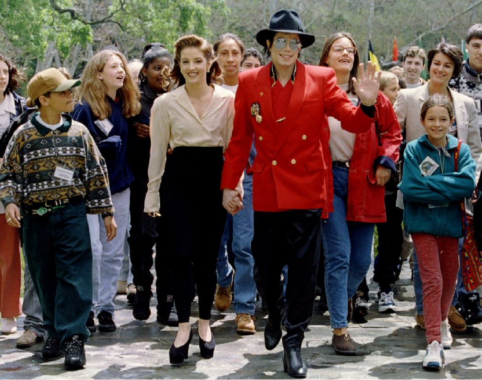 PHOTO: Michael Jackson and wife Lisa Marie Presley-Jackson welcome children from around the world as they arrive for a World Children's Conference at Jackson's Neverland Valley Ranch, in California, Apr. 18, 1995.